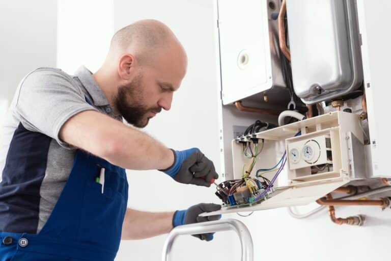 LPG Services Qualified engineer servicing a boiler