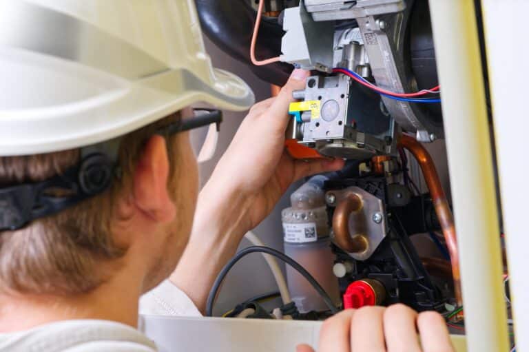 LPG Services Technician servicing or Repair of a gas boiler, setting up and servicing. gas boiler for heating